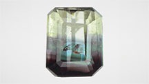 Figure 1. This 0.73 ct octagonal step cut was composed of chrysoberyl and alexandrite. The alexandrite portion showed a color change from blue-green in fluorescent light to red-purple in incandescent light. Photos by Shunsuke Nagai. Figure 1. This 0.73 ct octagonal step cut was composed of chrysoberyl and alexandrite. The alexandrite portion showed a color change from blue-green in fluorescent light to red-purple in incandescent light. Photos by Shunsuke Nagai.