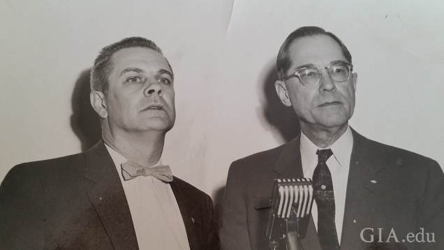 Two men in front of a microphone. Two men in front of a microphone.