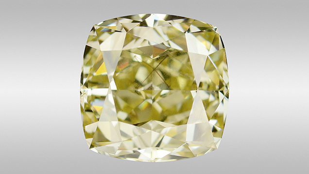 Fancy brownish greenish yellow diamond with octahedral-shaped inclusion. Fancy brownish greenish yellow diamond with octahedral-shaped inclusion.