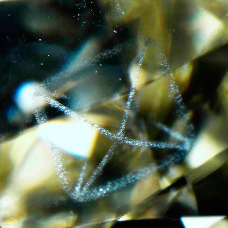 Graphite outlines the octahedral crystal faces. Graphite outlines the octahedral crystal faces.