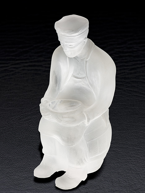 Paul Dreher figure of a gem carver holding a bowl Paul Dreher figure of a gem carver holding a bowl