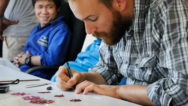 Field gemologist selects rubies in Mozambique