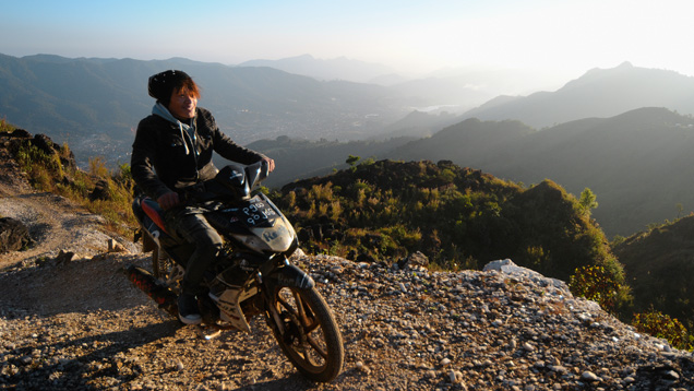 Artisanal miner on motorbike in Myanmar