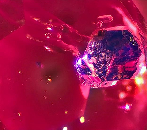 Bright blue lazurite inclusion in Mogok ruby. Bright blue lazurite inclusion in Mogok ruby.