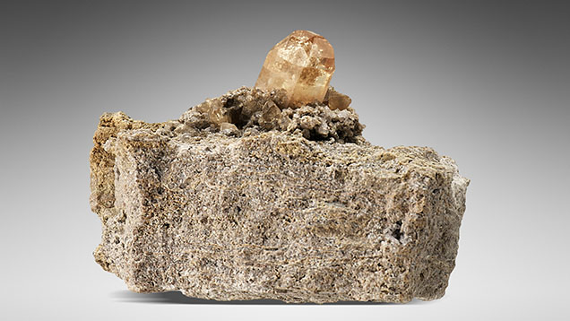 Figure 16. A topaz crystal on rhyolite matrix from the Thomas Range, Juab County, Utah. Photo by Robert Weldon.