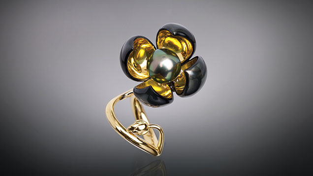 Figure 16. Shape-memory jewelry in the Blossom collection uses nitinol, a self-expanding titanium and nickel alloy that can transform in response to heat. This ring’s four flower petals are embedded with nitinol wires trained to gradually open and close based on temperature. Courtesy of Chi Huynh.