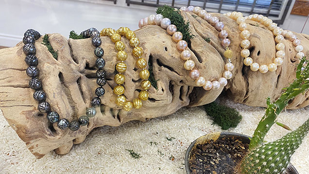 Figure 6. Tahitian, golden South Sea, and freshwater carved pearl necklaces from the Galatea collection. Photo by Artitaya Homkrajae.