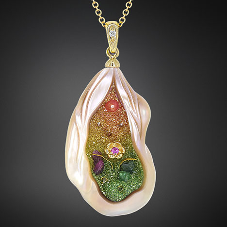 Figure 7. Because non-bead cultured freshwater pearls are composed mostly of nacre, the carving can be extended deep into the pearl’s body, allowing for more creativity. This “Pearl Garden” pendant was constructed using a 22 × 15 mm carved baroque freshwater pearl with lab-grown diamond and natural ruby, emerald, and garnet druzy placed within (Huynh, 2006). Courtesy of Chi Huynh.