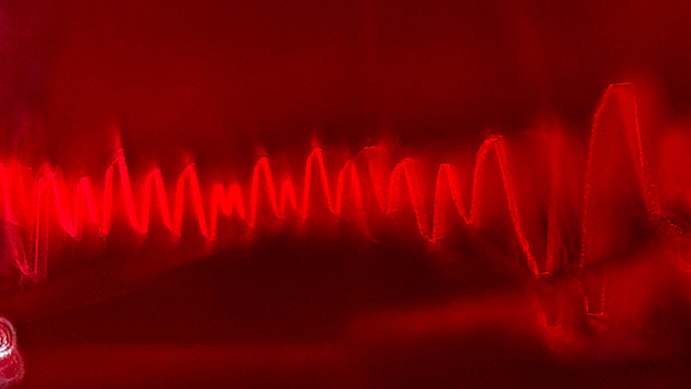 An electromagnetic wave-like pattern of whitish dust in Mong Hsu ruby. Photomicrograph by Narint Jaisanit; field of view 1.70 mm. An electromagnetic wave-like pattern of whitish dust in Mong Hsu ruby. Photomicrograph by Narint Jaisanit; field of view 1.70 mm.