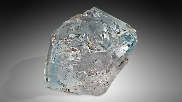 Figure 12. This 1,296 ct topaz crystal with a blue rim was recovered in Mason County, Texas. Photo by Ken Larsen; courtesy of the Smithsonian Institution Collection. Figure 12. This 1,296 ct topaz crystal with a blue rim was recovered in Mason County, Texas. Photo by Ken Larsen; courtesy of the Smithsonian Institution Collection.