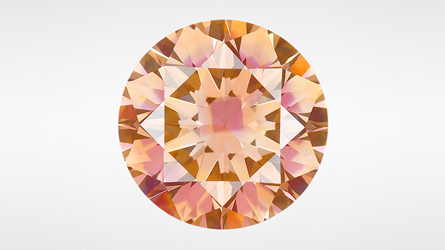 Figure 1. This 2.20 ct Fancy Deep brownish orange treated HPHT-grown diamond owes its distinctive appearance to multiple defect concentrations created within the various growth sectors. Photo by Diego Sanchez. Figure 1. This 2.20 ct Fancy Deep brownish orange treated HPHT-grown diamond owes its distinctive appearance to multiple defect concentrations created within the various growth sectors. Photo by Diego Sanchez.
