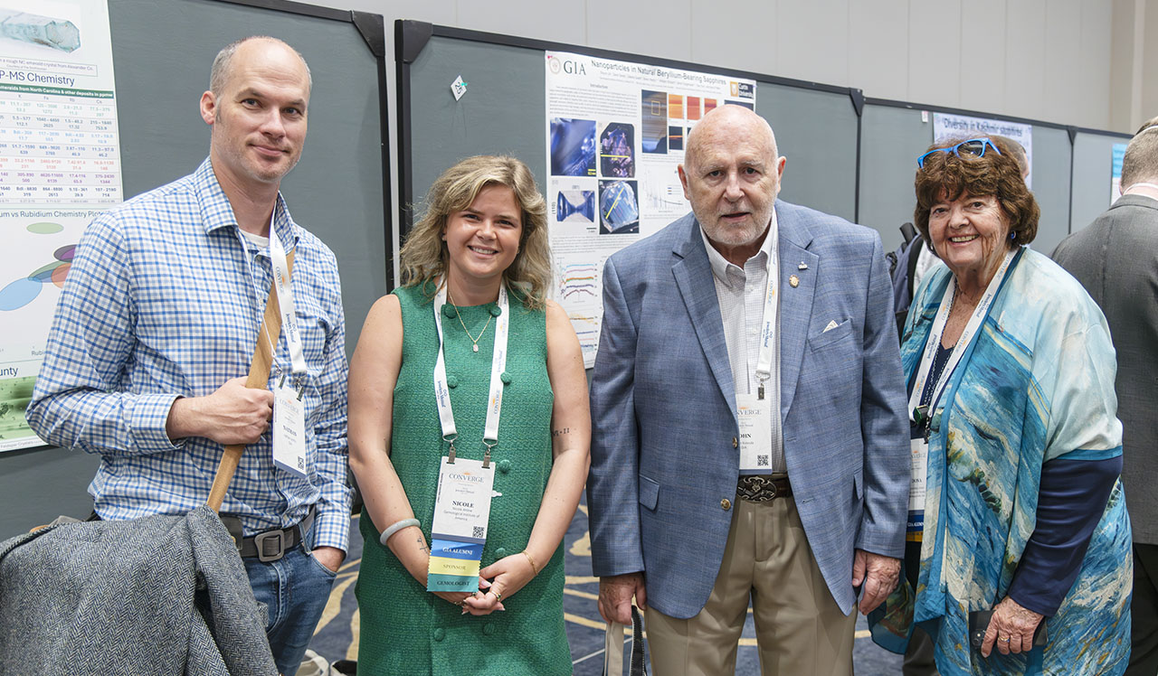 Figure 1. On hand to interact with Converge poster session attendees, GIA’s Nathan Renfro, Nicole Ahline, John Koivula, and librarian emerita, Dona Dirlam represent a wealth of gemological and geo-literary experience. Photo by Emily Lane. Figure 1. On hand to interact with Converge poster session attendees, GIA’s Nathan Renfro, Nicole Ahline, John Koivula, and librarian emerita, Dona Dirlam represent a wealth of gemological and geo-literary experience. Photo by Emily Lane.