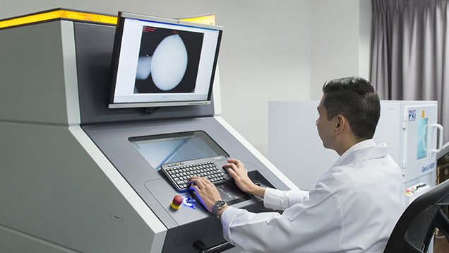 Figure 3. Modern gemological laboratories use real-time X-ray imaging systems to assess the transparency of gem materials, which is especially important for distinguishing natural from cultured pearls. Photo by Nuttapol Kitdee. Figure 3. Modern gemological laboratories use real-time X-ray imaging systems to assess the transparency of gem materials, which is especially important for distinguishing natural from cultured pearls. Photo by Nuttapol Kitdee.