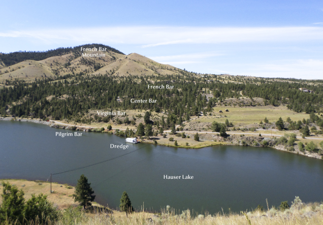 Figure 3. The view southwest across Hauser Lake from Riverside Campground. The French Bar complex starts underwater in Hauser Lake and continues steeply uphill southwest to the historic 1867–1869 hydraulic gold mining area, known as French Bar. The sapphire-bearing French Bar sill is poorly exposed and lies partially on Virginia Bar and Center Bar. Photo by Richard B. Berg; courtesy of the Montana Bureau of Mines and Geology. Figure 3. The view southwest across Hauser Lake from Riverside Campground. The French Bar complex starts underwater in Hauser Lake and continues steeply uphill southwest to the historic 1867–1869 hydraulic gold mining area, known as French Bar. The sapphire-bearing French Bar sill is poorly exposed and lies partially on Virginia Bar and Center Bar. Photo by Richard B. Berg; courtesy of the Montana Bureau of Mines and Geology.