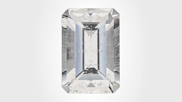 Figure 1. This 0.59 ct near-colorless octagonal step-cut armenite measuring 6.01 × 4.07 × 3.33 mm marks the first time this mineral has been submitted to a GIA laboratory. Photo by Diego Sanchez. Figure 1. This 0.59 ct near-colorless octagonal step-cut armenite measuring 6.01 × 4.07 × 3.33 mm marks the first time this mineral has been submitted to a GIA laboratory. Photo by Diego Sanchez.