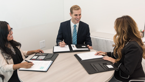 Three happy employees in professional attire Three happy employees in professional attire