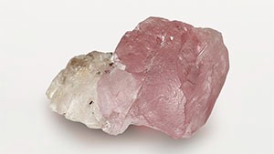 Figure 1. This 37.41 ct rough diamond has distinct pink and colorless zones. Photo by Tebogo Hambira. Figure 1. This 37.41 ct rough diamond has distinct pink and colorless zones. Photo by Tebogo Hambira.