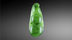 Figure 1. Face-up view of the 23.71 × 9.67 × 2.59 mm jade carving. Photo by Diego Sanchez. Figure 1. Face-up view of the 23.71 × 9.67 × 2.59 mm jade carving. Photo by Diego Sanchez.