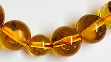 Amber rosary beads clearly show epoxy resin. Amber rosary beads clearly show epoxy resin.