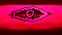 The reflection of a flux-healed fissure from a step pavilion facet in this Mong Hsu ruby resembles an evil eye. Photomicrograph by Ungkhana Atikarnsakul; field of view 1.07 mm. The reflection of a flux-healed fissure from a step pavilion facet in this Mong Hsu ruby resembles an evil eye. Photomicrograph by Ungkhana Atikarnsakul; field of view 1.07 mm.