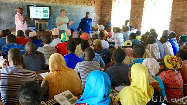 Pact representative Norbert Massay, GIA Graduate Gemologist (GG) Marvin Wambua and GIA’s library director Robert Weldon explaining the gem guide to artisanal miners in MoroGoro, Tanzania. Photo by Pedro Padua/GIA.