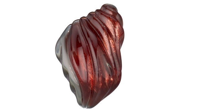A graceful carving displays this Oregon sunstone’s bright, reflective copper inclusions, its intense color, and its pleochroism. – Robert Weldon, courtesy Oregon Sunstone