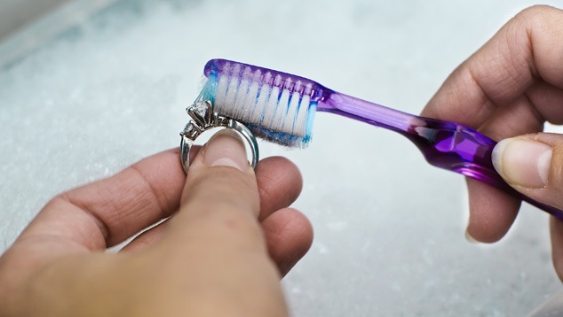 A safe way to clean iolite jewelry is to use lukewarm water with mild soap and a toothbrush. - Eric Welch A safe way to clean iolite jewelry is to use lukewarm water with mild soap and a toothbrush. - Eric Welch