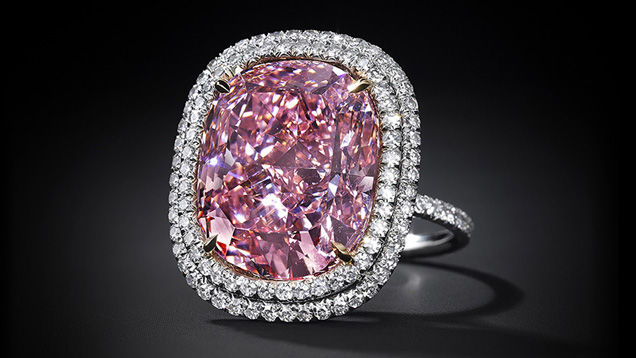 The 16 carat Fancy Vivid Pink diamond sold for $28.5 million to the same buyer who bought the record-breaking blue diamond. Photo courtesy Christie’s The 16 carat Fancy Vivid Pink diamond sold for $28.5 million to the same buyer who bought the record-breaking blue diamond. Photo courtesy Christie’s