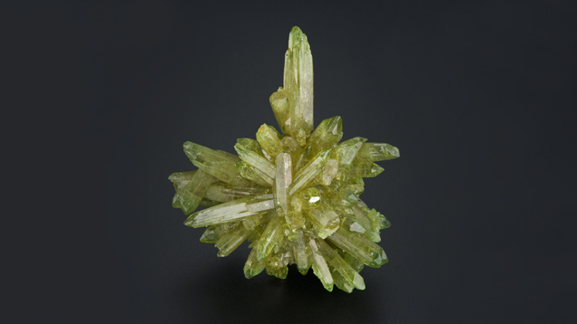 Spears of vesuvianite jut out in star-like patterns from the core. Spears of vesuvianite jut out in star-like patterns from the core.
