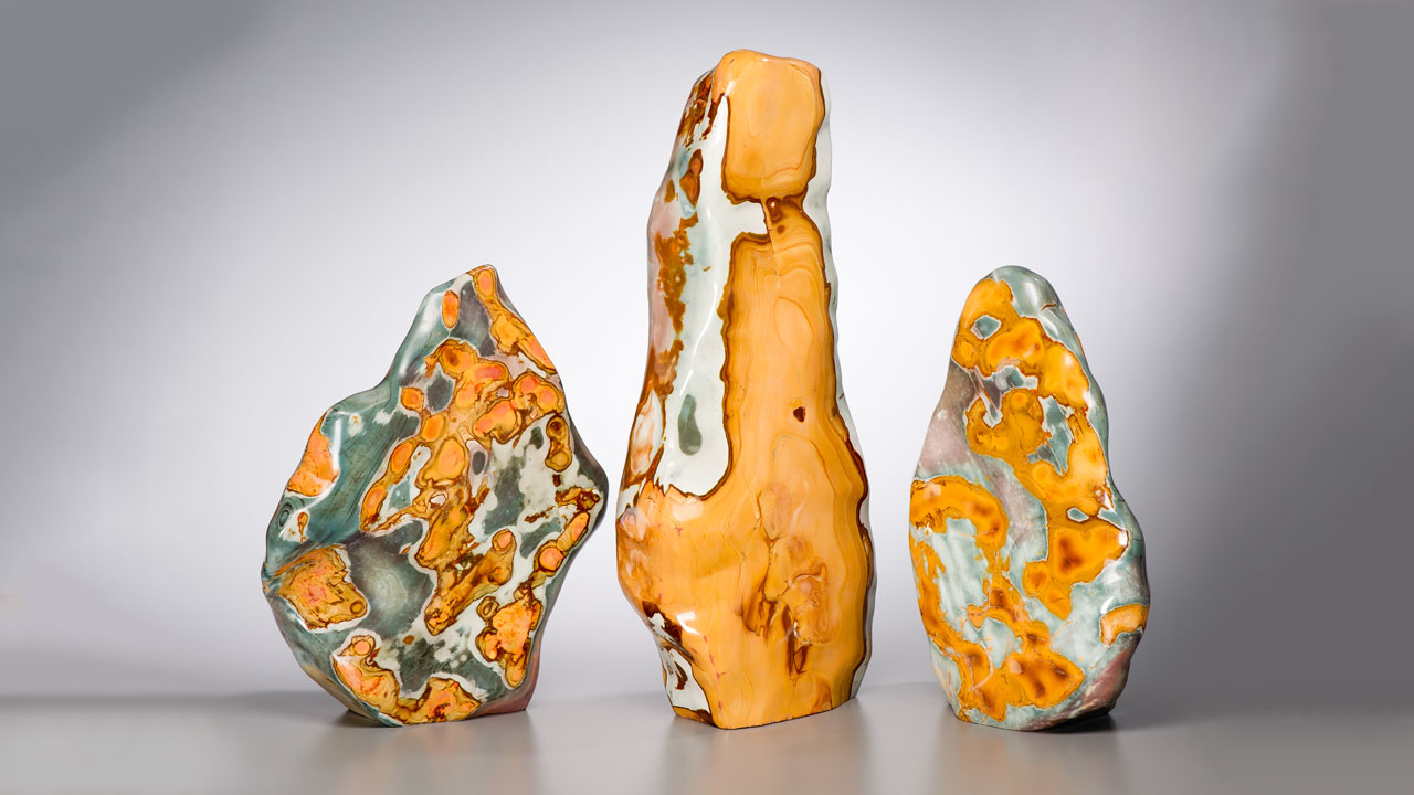 06.Jasper_1280x720.jpg. Three large free-form pieces of jasper from Madagascar are prominently highlighted. Photo by Kevin Schumacher/GIA
