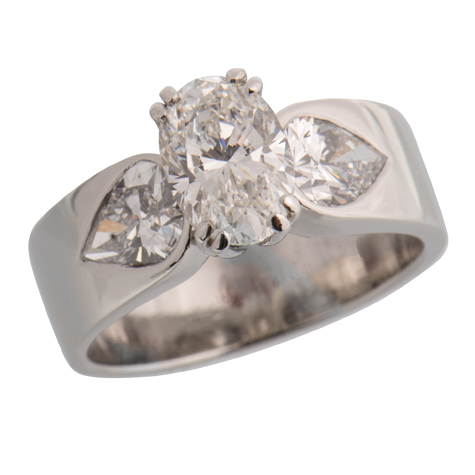 Perspective view of an oval solitaire with large, pear-shaped diamonds set in the wide shank Perspective view of an oval solitaire with large, pear-shaped diamonds set in the wide shank