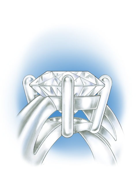 Close-up view of a four-prong, platinum solitaire with a round center stone Close-up view of a four-prong, platinum solitaire with a round center stone