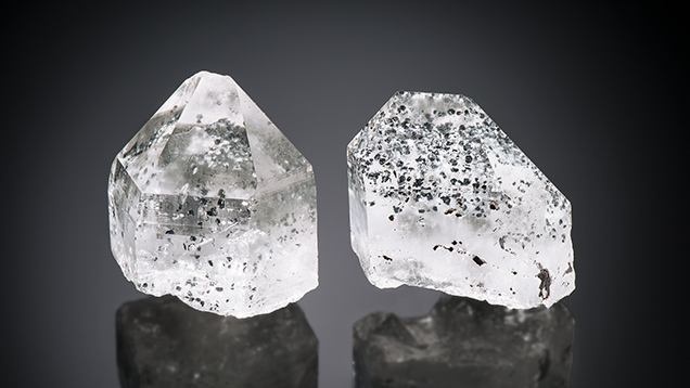 Quartz crystals with dark inclusions.