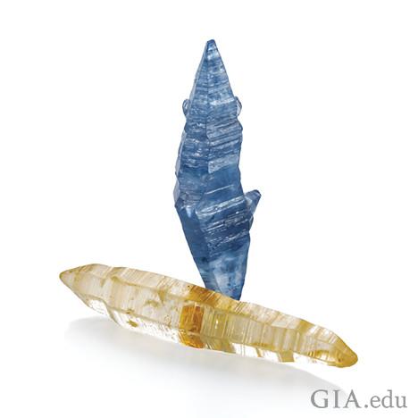 Image showing two sapphire crystals, one blue and one yellowish-white. Image showing two sapphire crystals, one blue and one yellowish-white.