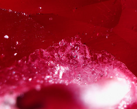 Synthetic overgrowth on heated Burmese ruby.