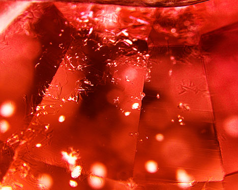 Synthetic overgrowth on Be-diffused sapphire.