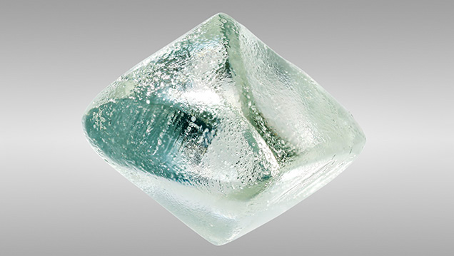 Sub-hexagonal etch pits in synthetic moissanite. Sub-hexagonal etch pits in synthetic moissanite.