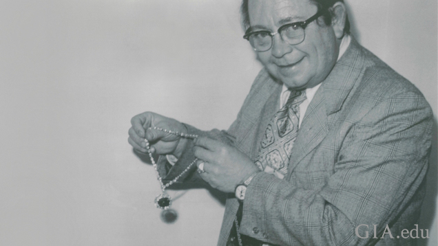 Man holds the Hope Diamond necklace. Man holds the Hope Diamond necklace.