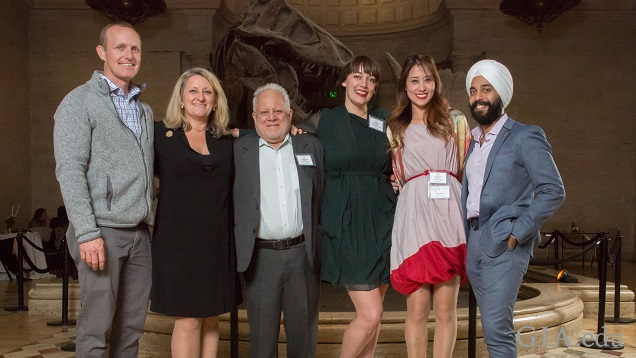 Six people stand in line for a photo. Six people stand in line for a photo.