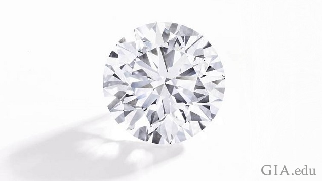 A round brilliant diamond on a white background. A round brilliant diamond on a white background.
