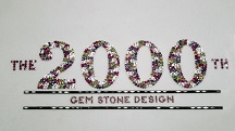 The gems spell out “The 2000th Gem Stone Design.”