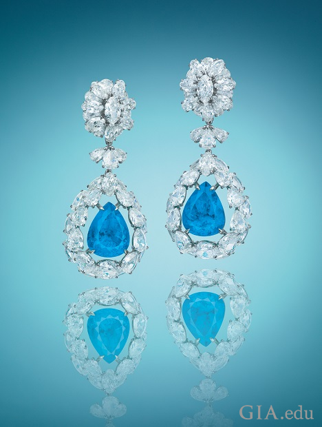 Pear shaped Paraíba tourmalines are framed by pear shaped diamonds and drop from more pear shaped diamonds.