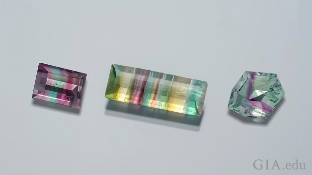 There pieces of faceted fluorites (square, rectangle and octagonal) show pink, purple, green, yellow and turquoise bands of color.
