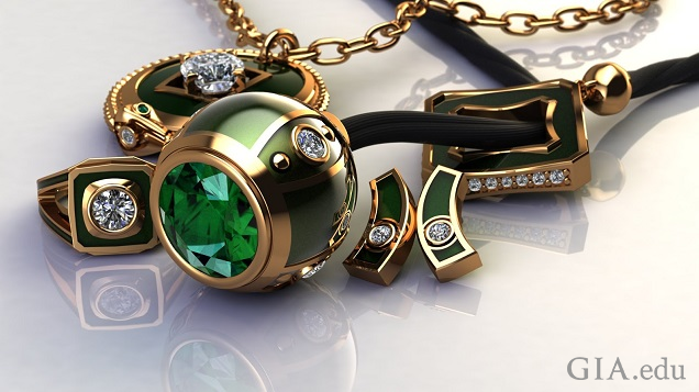 Close-up shot of 18K yellow gold, emerald, enamel and diamond lariet suite, inclusing ring, lariet, pendant and earrings.