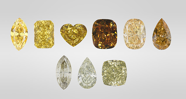 Figure 1. Yellow is the most common color in 480 nm band diamonds and can occur in different tones and saturations (top row, three on the left). The 480 nm band diamond family also includes those with brown and orange colors (top row, three on the right), as well as chameleon diamonds with a green color component (bottom row). Photos by GIA staff. Figure 1. Yellow is the most common color in 480 nm band diamonds and can occur in different tones and saturations (top row, three on the left). The 480 nm band diamond family also includes those with brown and orange colors (top row, three on the right), as well as chameleon diamonds with a green color component (bottom row). Photos by GIA staff.