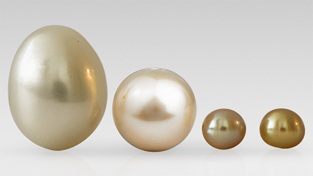 Three cultured pearls, one natural Three cultured pearls, one natural