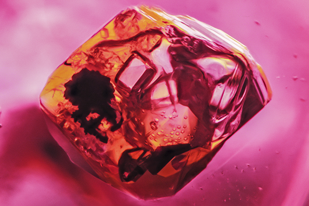 Negative crystal in Burmese red spinel. Negative crystal in Burmese red spinel.